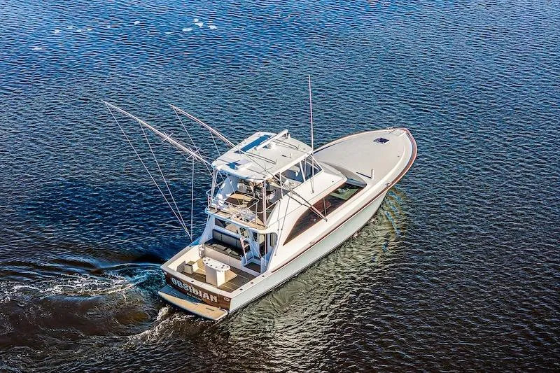 Slide: The Image of Aerial view of 1991 Ocean Yachts 53 Super Sport cruising on open water. - 4