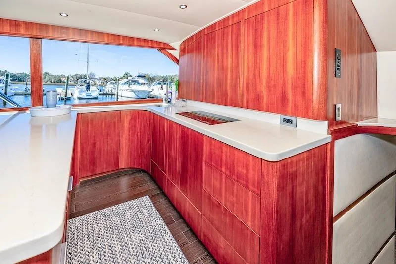 Slide: The Image of Luxurious interior of 1991 Ocean Yachts 53 Super Sport with sleek wooden cabinetry. - 41