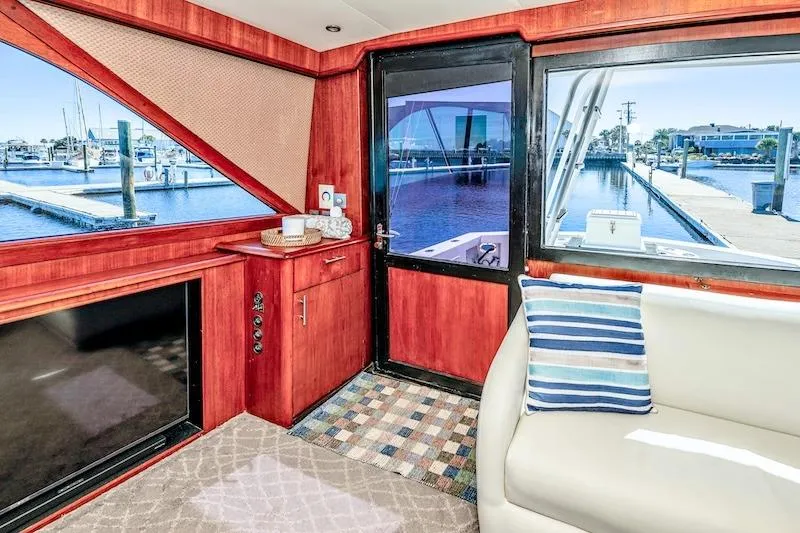 Slide: The Image of Interior of 1991 Ocean Yachts 53 Super Sport with marina view through windows. - 43