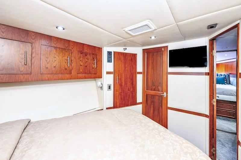 Slide: The Image of Luxurious cabin interior of 1991 Ocean Yachts 53 Super Sport with wood accents and modern amenities. - 50