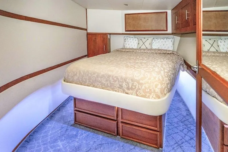 Slide: The Image of Luxurious bedroom interior of 1991 Ocean Yachts 53 Super Sport with elegant bedding and wood accents. - 52