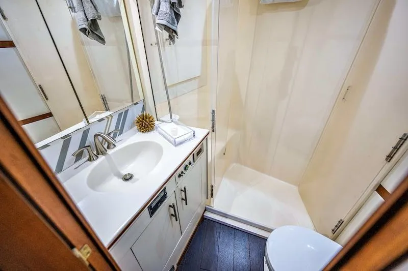 Slide: The Image of Bathroom interior of 1991 Ocean Yachts 53 Super Sport with shower and sink. - 53