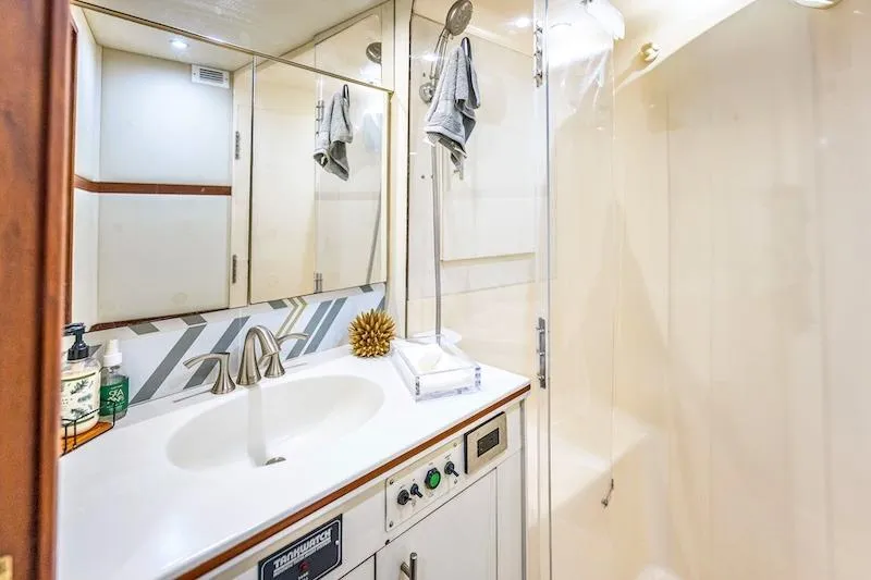Slide: The Image of Bathroom interior of 1991 Ocean Yachts 53 Super Sport with modern fixtures and shower. - 54