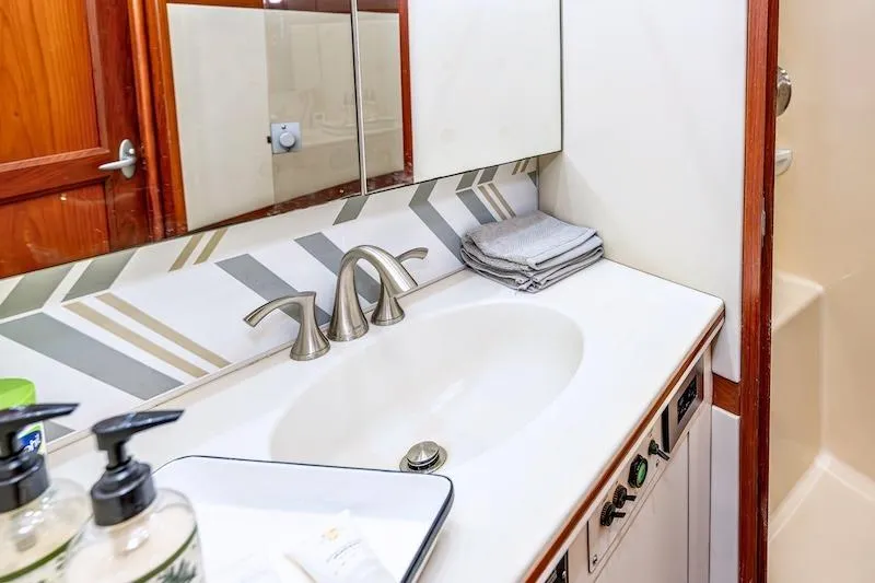 Slide: The Image of Bathroom interior of 1991 Ocean Yachts 53 Super Sport with modern sink and fixtures. - 57