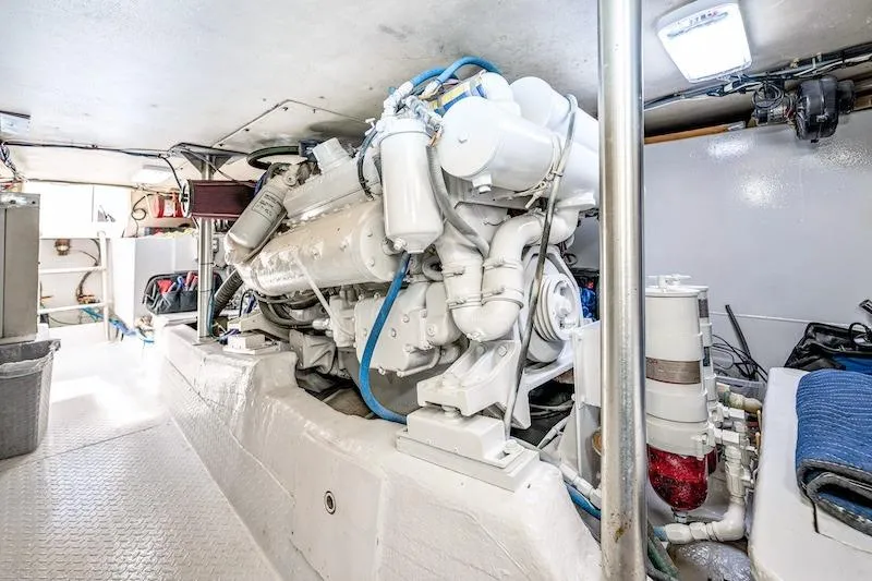 Slide: The Image of Engine room of 1991 Ocean Yachts 53 Super Sport, showcasing a powerful marine engine. - 60