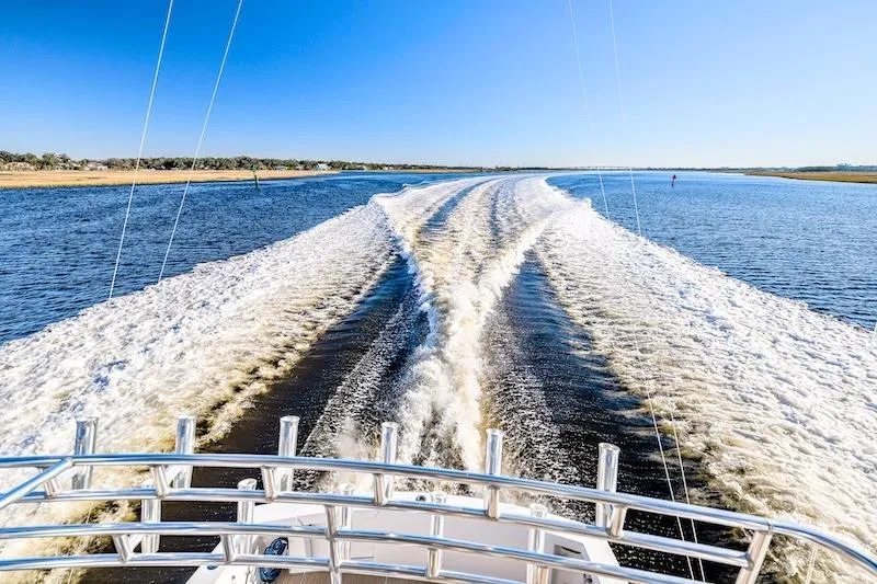 Slide: The Image of Ocean Yachts 1991 53 Super Sport cruising, leaving a wake on a sunny day. - 11