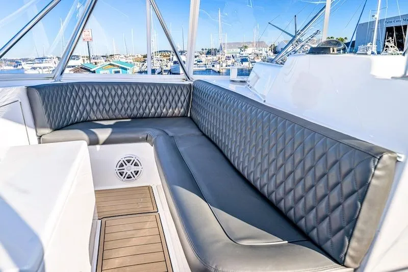 Slide: The Image of Luxurious seating area on a 1991 Ocean Yachts 53 Super Sport, docked at a marina. - 14