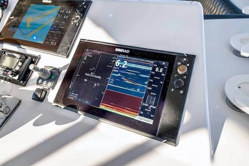 Slide: The Image of Control panel of a 1991 Ocean Yachts 53 Super Sport with Simrad navigation displays. - 21