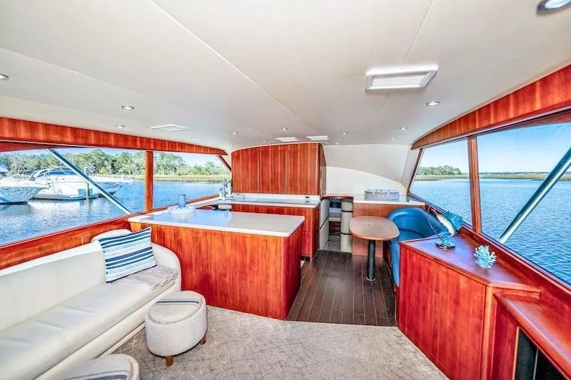 Slide: The Image of Luxurious interior of 1991 Ocean Yachts 53 Super Sport with elegant wood finishes and scenic water views. - 27