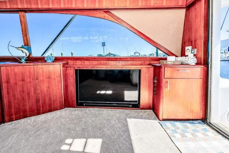 Slide: The Image of Interior of 1991 Ocean Yachts 53 Super Sport with wood cabinetry and large window. - 32