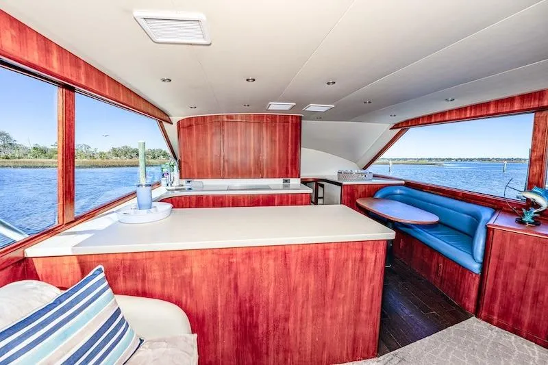 Slide: The Image of Interior of 1991 Ocean Yachts 53 Super Sport with wood finish and blue seating. - 34