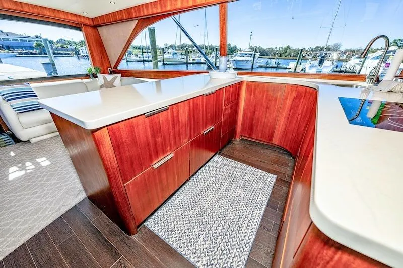 Slide: The Image of Luxurious interior of 1991 Ocean Yachts 53 Super Sport with elegant wood cabinetry and waterfront view. - 40