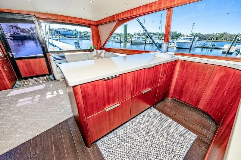 Slide: The Image of Luxurious interior of 1991 Ocean Yachts 53 Super Sport with wood cabinetry and waterfront view. - 42