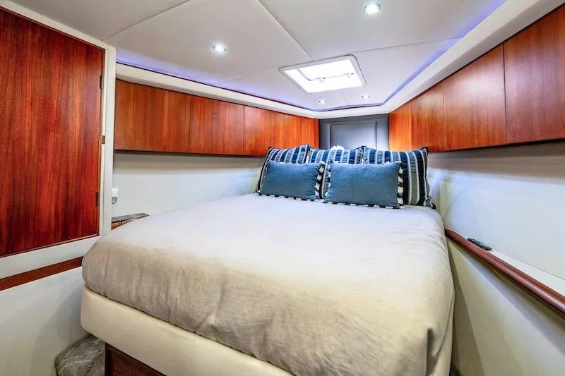 Slide: The Image of Luxurious cabin interior of 1991 Ocean Yachts 53 Super Sport with cozy bedding. - 55