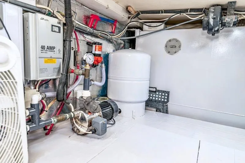 Slide: The Image of Engine room of 1991 Ocean Yachts 53 Super Sport with equipment and wiring. - 65