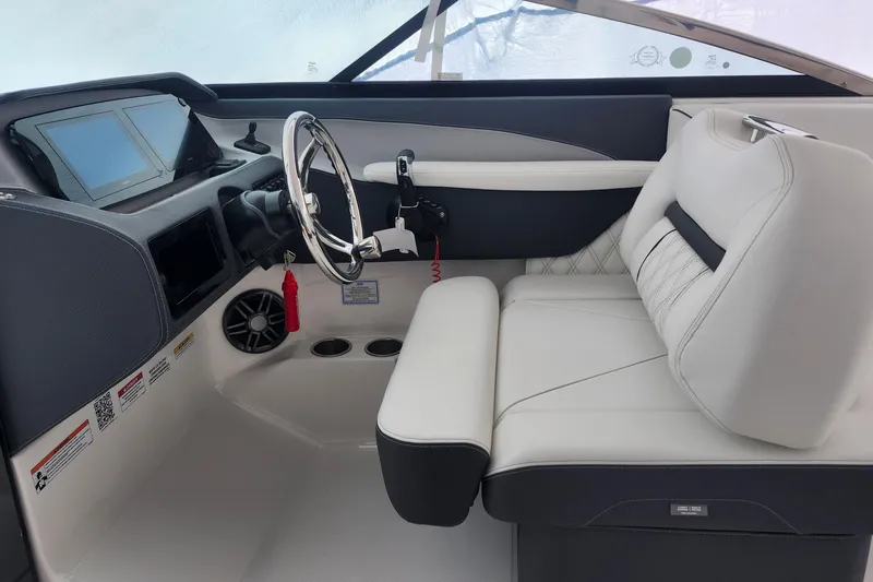 Slide: The Image of 2026 Regal LX6 boat interior with modern dashboard and luxurious seating. - 13
