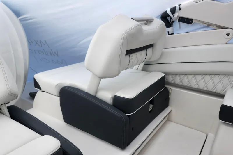 Slide: The Image of 2026 Regal LX6 boat interior with luxurious white seating and modern design. - 24
