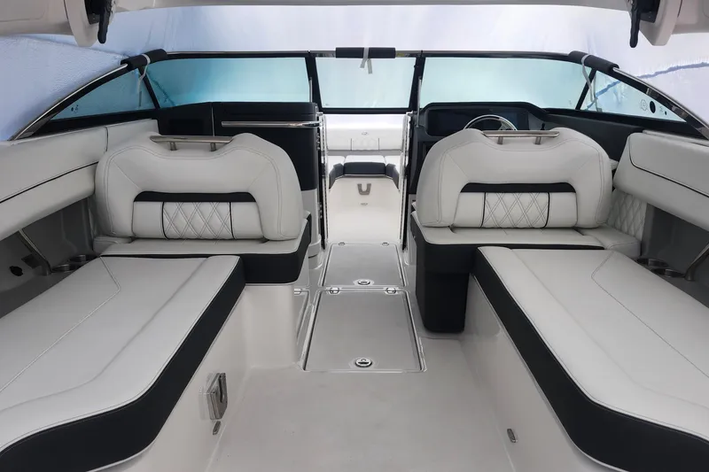 Slide: The Image of Luxurious interior of 2026 Regal LX6 boat with elegant white seating and modern design. - 27