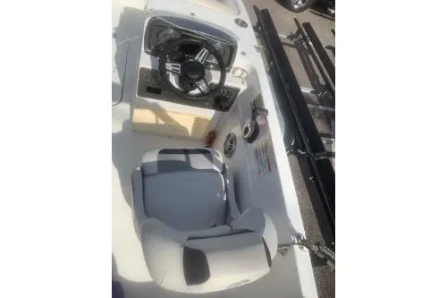 Slide: The Image of 2023 Hurricane SunDeck Sport 188 OB boat cockpit with steering wheel and seating. - 4