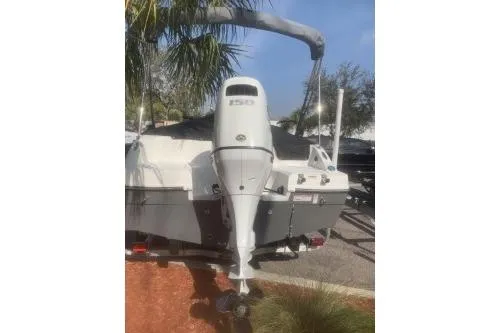 Slide: The Image of 2023 Hurricane SunDeck Sport 188 OB boat, rear view with outboard motor. - 7