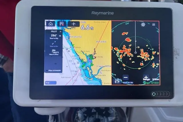 Slide: The Image of Raymarine navigation display on 1994 Island Packet 320 sailboat, showing map and radar data. - 5