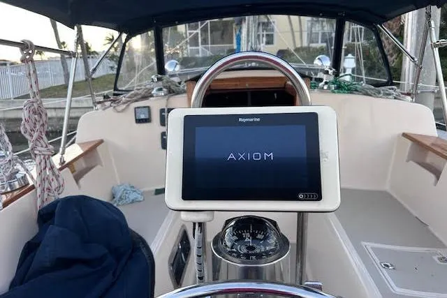 Slide: The Image of Cockpit of 1994 Island Packet 320 sailboat with Raymarine Axiom navigation display. - 6