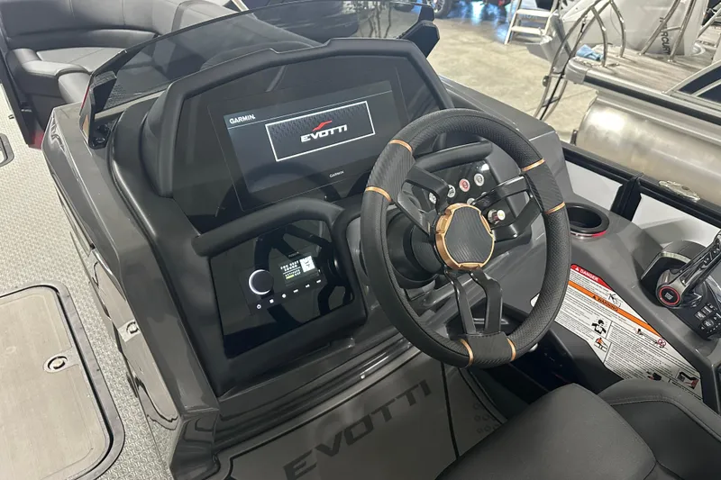 Slide: The Image of Luxurious interior of 2026 Evotti 725 QL boat with sleek black seating. - 14