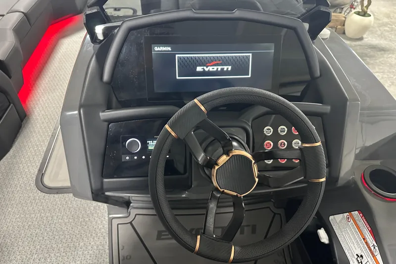 Slide: The Image of Steering console of 2026 Evotti 725 QL boat with advanced controls and display. - 15
