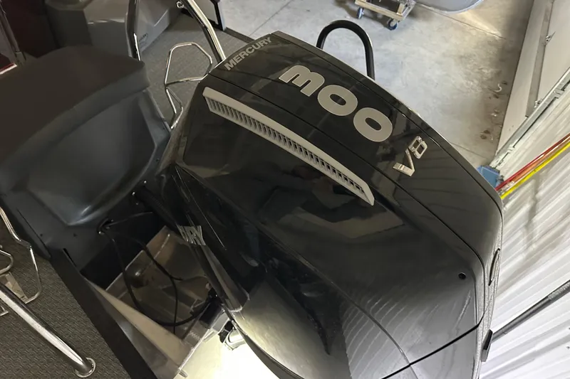 Slide: The Image of Luxurious 2026 Evotti 725 QL boat interior with ambient red lighting and sleek black seating. - 2