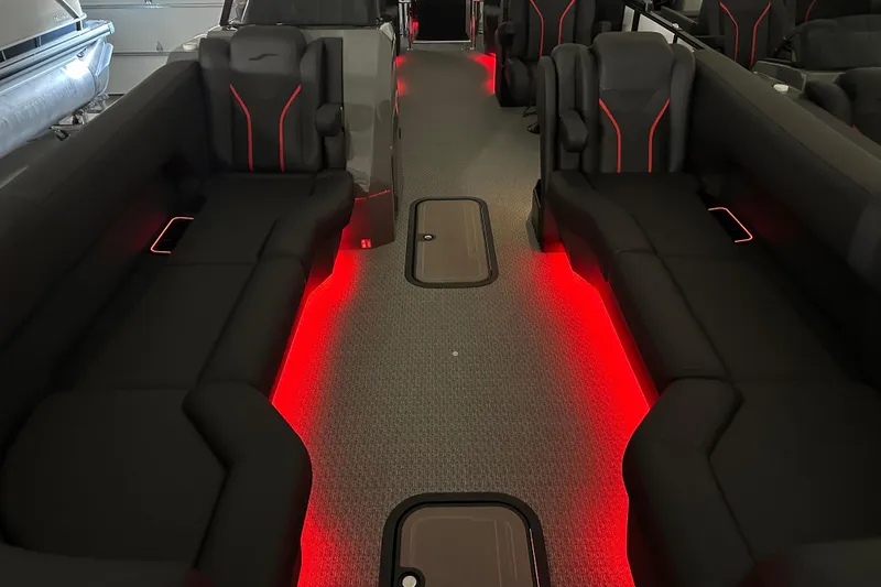 Slide: The Image of Luxurious Evotti 725 QL interior with sleek black seating and ambient red lighting, 2026 model. - 20