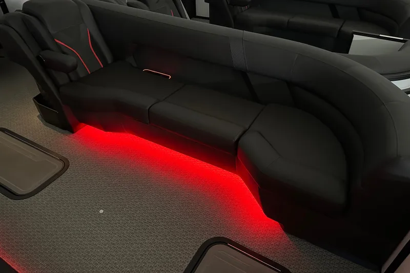 Slide: The Image of Luxurious Evotti 725 QL interior with sleek black seating and ambient red lighting, 2026 model. - 24