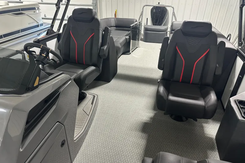 Slide: The Image of Luxurious interior of 2026 Evotti 725 QL boat with sleek black seating and red accents. - 9