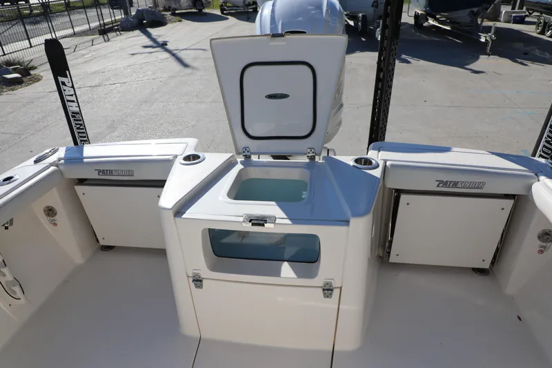Slide: The Image of 2023 Pathfinder 2700 Open boat interior with storage compartments and livewell. - 13