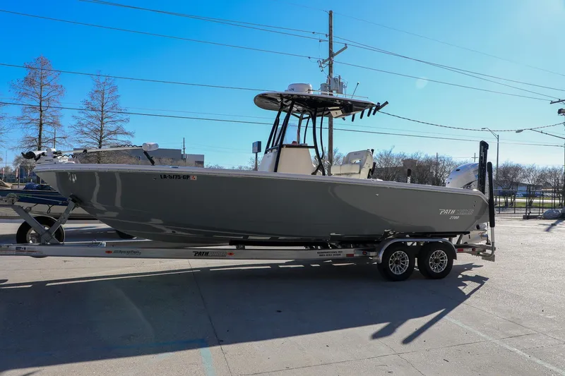 Slide: The Image of 2023 Pathfinder 2700 Open boat on trailer under clear blue sky. - 17