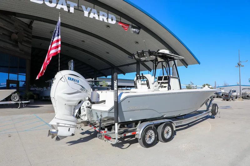 Slide: The Image of 2023 Pathfinder 2700 Open boat with Yamaha engine at a boat yard. - 3