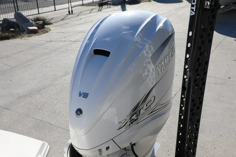 Slide: The Image of Yamaha V8 outboard motor on 2023 Pathfinder 2700 Open boat, parked outdoors. - 4