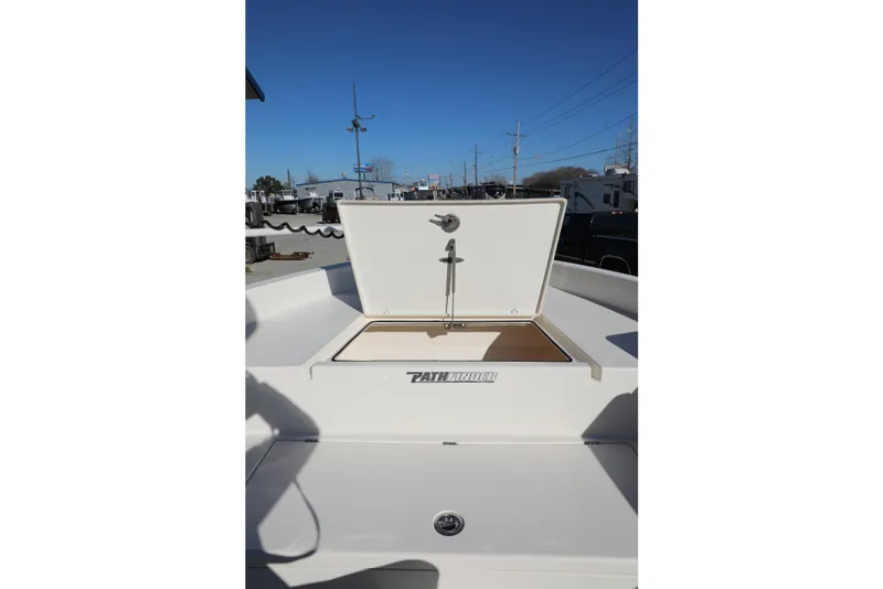 Slide: The Image of 2023 Pathfinder 2700 Open boat with open storage compartment under clear blue sky. - 8