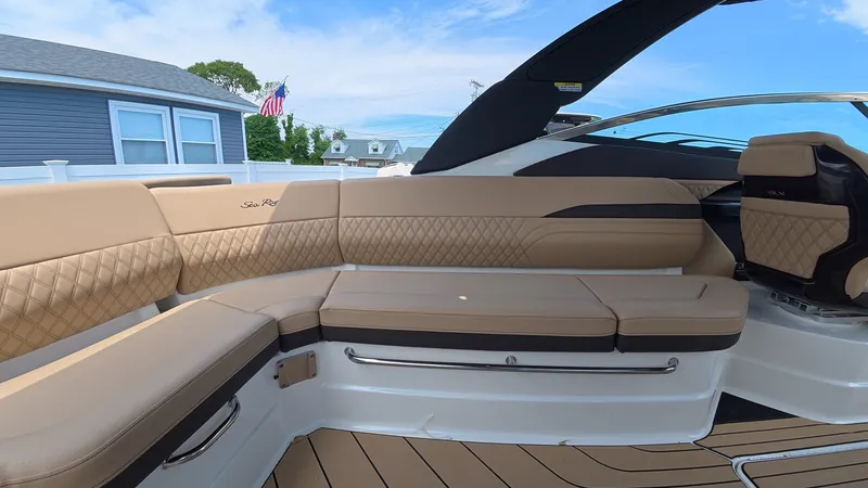 Slide: The Image of Luxurious seating area on a modern boat with beige upholstery and elegant stitching. - 9