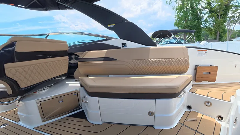 Slide: The Image of Luxurious seating on a modern boat with sleek upholstery and wood accents. - 10