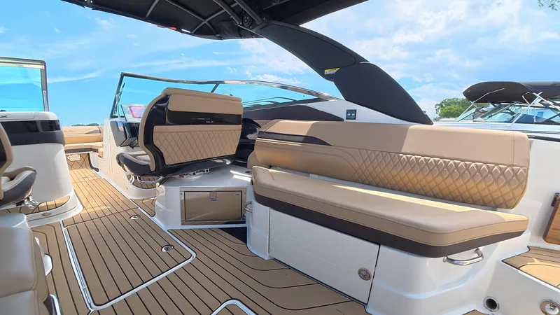 Slide: The Image of Interior view of a luxury boat with cushioned seats and wooden flooring. - 11