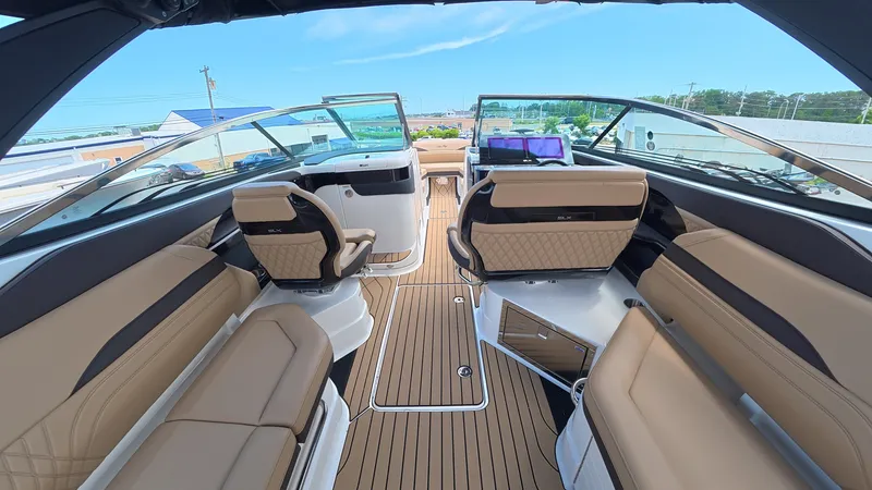 Slide: The Image of Interior view of a modern boat with sleek seating and wooden flooring. - 12