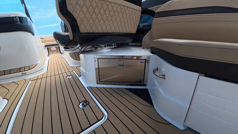 Slide: The Image of Interior of a modern boat with sleek seating and wooden flooring. - 13