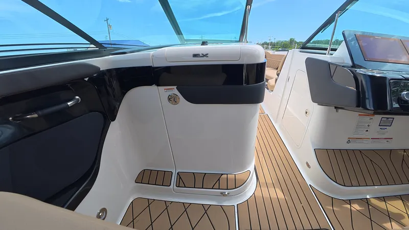 Slide: The Image of Interior view of a Sea Ray SLX 280 Outboard with sleek seating and modern dashboard. - 24
