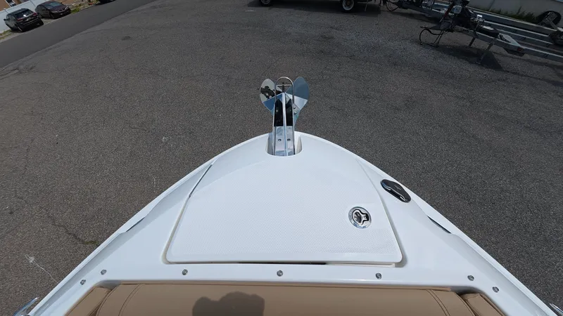 Slide: The Image of The bow of a Sea Ray SLX 280 Outboard boat on a parking lot. - 28