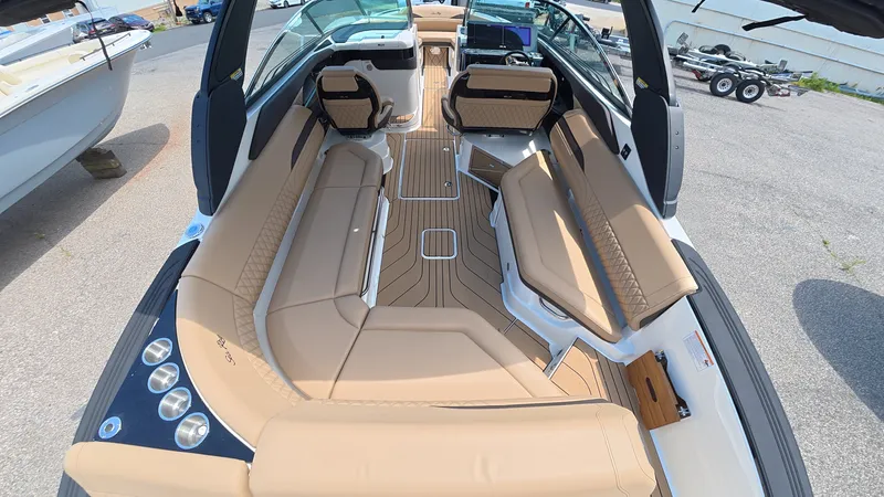 Slide: The Image of Interior view of a luxury boat with beige leather seating and wooden flooring. - 6