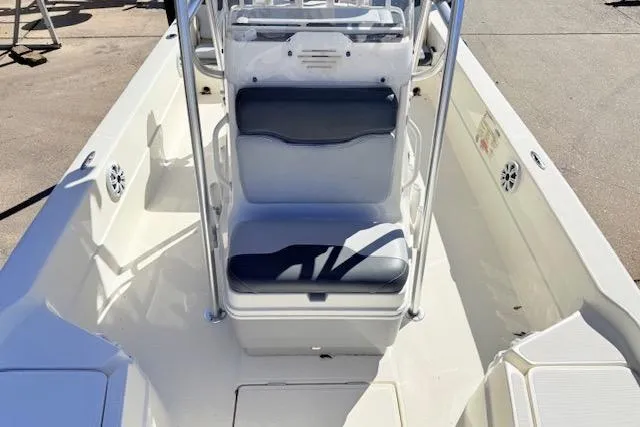 Slide: The Image of 2017 Skeeter SX240 boat interior with seating and console, showcasing spacious design. - 11