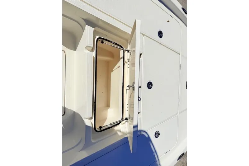 Slide: The Image of 2017 Skeeter SX240 boat storage compartment with open hatch, showcasing interior space. - 13