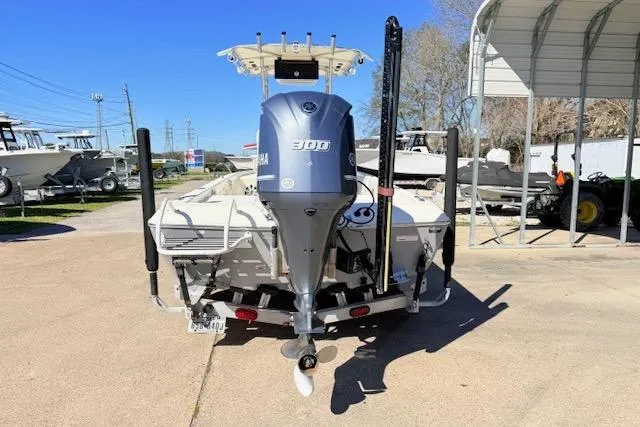 Slide: The Image of 2017 Skeeter SX240 boat with Yamaha 300 engine, parked outdoors. - 3