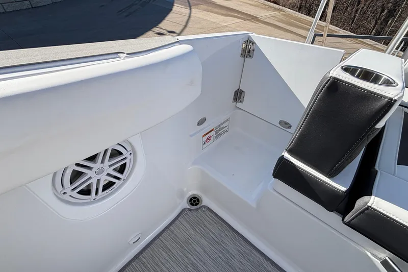 Slide: The Image of 2026 Monterey Elite 30 OB boat interior with speaker and cup holder. - 10