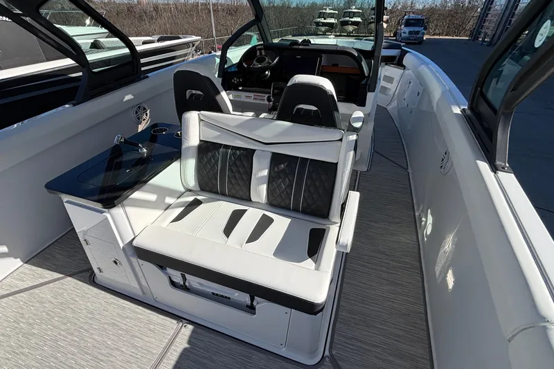 Slide: The Image of 2026 Monterey Elite 30 OB boat interior with luxurious seating and sleek design. - 11